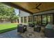 Relaxing covered patio featuring comfortable seating, stylish design, and backyard access at 2805 Van Dyke Ave, Raleigh, NC 27607