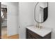 Stylish powder room with modern vanity, undermount sink, quartz countertop, and elegant gold faucet at 2805 Van Dyke Ave, Raleigh, NC 27607