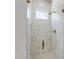 Elegant marble shower with glass door and gold fixtures at 2805 Van Dyke Ave, Raleigh, NC 27607