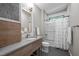 Bathroom featuring a single vanity, tiled shower, and neutral colors at 3095 Champs Way, Mebane, NC 27302