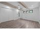 Bedroom boasts wood floors, beams, closet, and modern design at 3095 Champs Way, Mebane, NC 27302