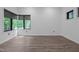 Well lit bedroom with modern windows and hardwood floors at 3095 Champs Way, Mebane, NC 27302