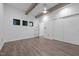 Open bedroom featuring exposed beams, modern windows and closet space at 3095 Champs Way, Mebane, NC 27302