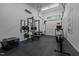 Finished garage space showcasing workout equipment and air conditioning at 3095 Champs Way, Mebane, NC 27302
