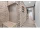 Unique hallway with wood floors, brick walls, and a unique elevator at 3095 Champs Way, Mebane, NC 27302
