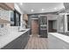 Kitchen featuring modern cabinets, floating shelves, and stainless steel appliances at 3095 Champs Way, Mebane, NC 27302
