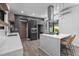 Modern kitchen with stainless steel appliances, island with seating, and ample counter space at 3095 Champs Way, Mebane, NC 27302
