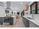 Spacious kitchen with stainless appliances, black and gray cabinetry, and marble countertops at 3095 Champs Way, Mebane, NC 27302