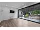 Bright living room boasting a sliding glass door, recessed lights and wood floors at 3095 Champs Way, Mebane, NC 27302