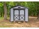 Backyard shed featuring double doors with black trim at 3095 Champs Way, Mebane, NC 27302