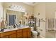 Bathroom featuring a double vanity, large mirror, and decorative accents at 320 Madres Ln, Morrisville, NC 27560