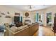 Inviting living room featuring hardwood floors, a fireplace, and access to outdoor patio at 320 Madres Ln, Morrisville, NC 27560