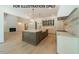 Open-concept kitchen with a large island, modern appliances, and ample cabinet space at 3422 Redbud Ln, Raleigh, NC 27607