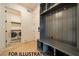 Organized mudroom with built-in storage, hooks, and a nearby laundry room at 3422 Redbud Ln, Raleigh, NC 27607