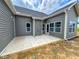 New construction with a back patio and gray vinyl siding at 356 Beacon Hill Rd # 103, Lillington, NC 27546