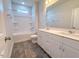 Bathroom with double vanity, white cabinets, and a tub and shower at 356 Beacon Hill Rd # 103, Lillington, NC 27546