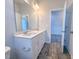 Bathroom with white vanity, double sinks, and view into another room at 356 Beacon Hill Rd # 103, Lillington, NC 27546