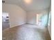 Carpeted bedroom with multiple entryways and natural light from a window at 356 Beacon Hill Rd # 103, Lillington, NC 27546