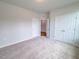 Cozy bedroom with closet and white doors, offering ample storage space at 356 Beacon Hill Rd # 103, Lillington, NC 27546