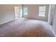 Spacious bedroom features plush carpeting, bright windows, and a ensuite bathroom at 356 Beacon Hill Rd # 103, Lillington, NC 27546