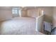 Bright bonus room with carpet flooring, recessed lights, and staircase to the lower level at 356 Beacon Hill Rd # 103, Lillington, NC 27546