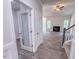 Entryway view of the living room showcasing the fireplace and staircase at 356 Beacon Hill Rd # 103, Lillington, NC 27546