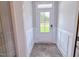 Entryway featuring a stylish door with glass panels, wood-look flooring and white molding at 356 Beacon Hill Rd # 103, Lillington, NC 27546