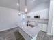 This kitchen features granite countertops, new appliances and an island sink at 356 Beacon Hill Rd # 103, Lillington, NC 27546