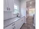 This kitchen features granite countertops, white cabinets, and new appliances at 356 Beacon Hill Rd # 103, Lillington, NC 27546