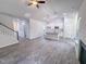 This living room features vaulted ceilings, kitchen access, and an open floor plan at 356 Beacon Hill Rd # 103, Lillington, NC 27546