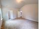 Open living room with plush carpeting and high ceilings, perfect for entertaining guests at 356 Beacon Hill Rd # 103, Lillington, NC 27546