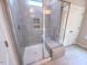Modern walk-in shower with glass enclosure, built-in bench, and tiled walls at 356 Beacon Hill Rd # 103, Lillington, NC 27546
