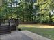 Expansive backyard featuring a combination of manicured lawn and wooded area at 395 Wyndham Place Dr, Fuquay Varina, NC 27526