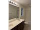 Bathroom featuring a double vanity and shower with glass door at 395 Wyndham Place Dr, Fuquay Varina, NC 27526