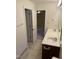 Bathroom with double vanity and doorway into bedroom at 395 Wyndham Place Dr, Fuquay Varina, NC 27526