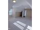 Spacious bedroom featuring carpeted floors, natural light, and easy access to other rooms at 395 Wyndham Place Dr, Fuquay Varina, NC 27526