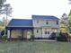 Rear exterior of home features covered patio and upper deck at 395 Wyndham Place Dr, Fuquay Varina, NC 27526