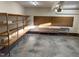 Spacious garage featuring ample storage and shelving units at 395 Wyndham Place Dr, Fuquay Varina, NC 27526