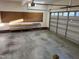 Spacious garage featuring built-in work bench and garage door to the exterior at 395 Wyndham Place Dr, Fuquay Varina, NC 27526