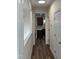 Inviting hallway with wood floors leading to the kitchen, providing a seamless flow throughout the home at 395 Wyndham Place Dr, Fuquay Varina, NC 27526