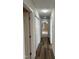 Hallway with wood floors leading to multiple rooms at 395 Wyndham Place Dr, Fuquay Varina, NC 27526
