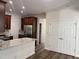 Open kitchen with granite countertops, stainless steel appliances, and a breakfast bar for casual dining at 395 Wyndham Place Dr, Fuquay Varina, NC 27526