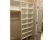 Walk-in closet with custom shelving units at 395 Wyndham Place Dr, Fuquay Varina, NC 27526