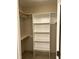 Walk-in closet with custom shelving units at 395 Wyndham Place Dr, Fuquay Varina, NC 27526