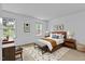 Stylishly staged bedroom showcasing a comfortable bed and modern decor elements at 4009 Olde Coach Rd, Durham, NC 27707
