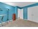 A spacious bedroom is painted blue with a large closet for storage at 4009 Olde Coach Rd, Durham, NC 27707