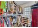 Walk-in closet with custom shelving and organized clothing racks at 4009 Olde Coach Rd, Durham, NC 27707