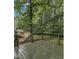 Relaxing outdoor deck area, perfect for enjoying the wooded backyard at 4009 Olde Coach Rd, Durham, NC 27707