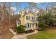 Charming two-story home with manicured landscaping, featuring a bay window and inviting front porch at 4009 Olde Coach Rd, Durham, NC 27707