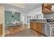 Bright kitchen with stainless steel appliances, dining table, and natural light at 4009 Olde Coach Rd, Durham, NC 27707